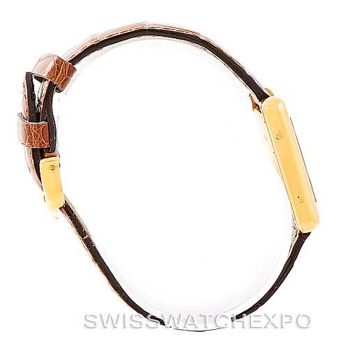 The image shows a side view of the Cartier Tank Louis W1529856 Women's Yellow Gold Silver Dial W1529856 Women's Yellow Gold Silver Dial watch, highlighting the case and leather strap.