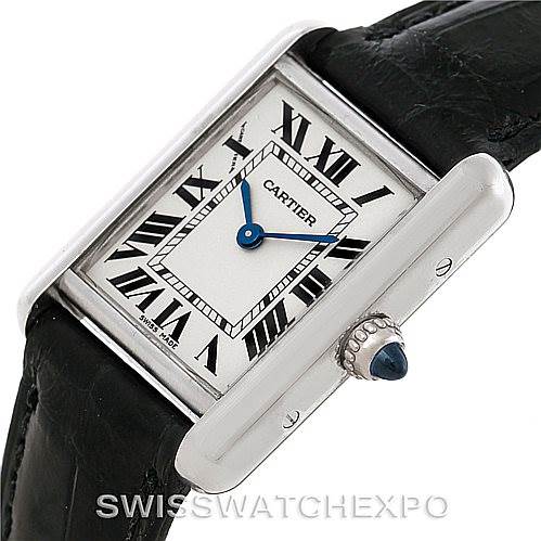 The image shows a close-up angled view of the Cartier Tank Louis W1541056 Women's White Gold Silver Dial W1541056 Women's White Gold Silver Dial watch, highlighting the face, roman numerals, and crown with blue cabochon.