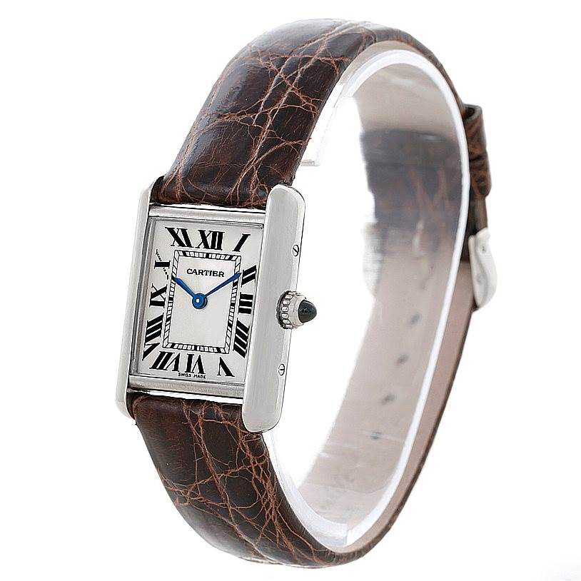 The Cartier Tank Louis W1541056 Women's White Gold Silver Dial W1541056 Women's White Gold Silver Dial watch is shown at a slight angle highlighting its face, crown, and brown leather strap.