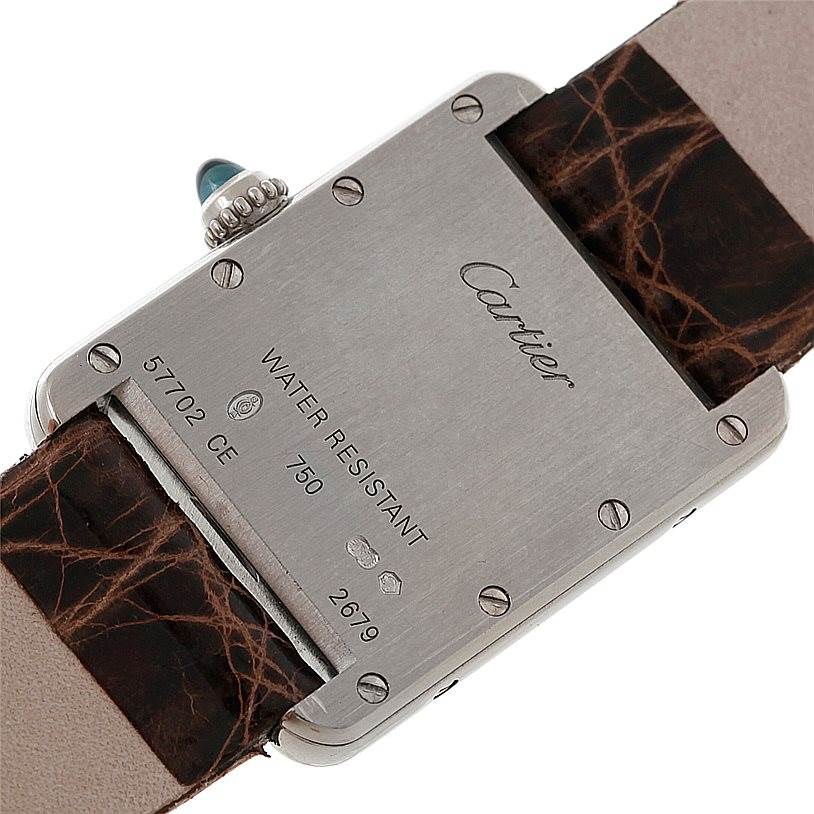 This image shows the back case and leather strap of the Cartier Tank Louis W1541056 Women's White Gold Silver Dial W1541056 Women's White Gold Silver Dial watch, displaying its engravings and screws.