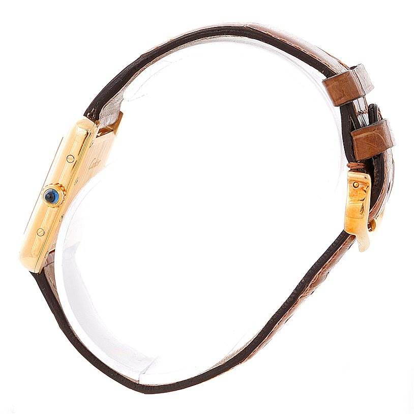 The image shows a side view of the Cartier Tank Louis W1529856 Women's Yellow Gold Silver Dial W1529856 Women's Yellow Gold Silver Dial watch, highlighting its crown and leather strap.