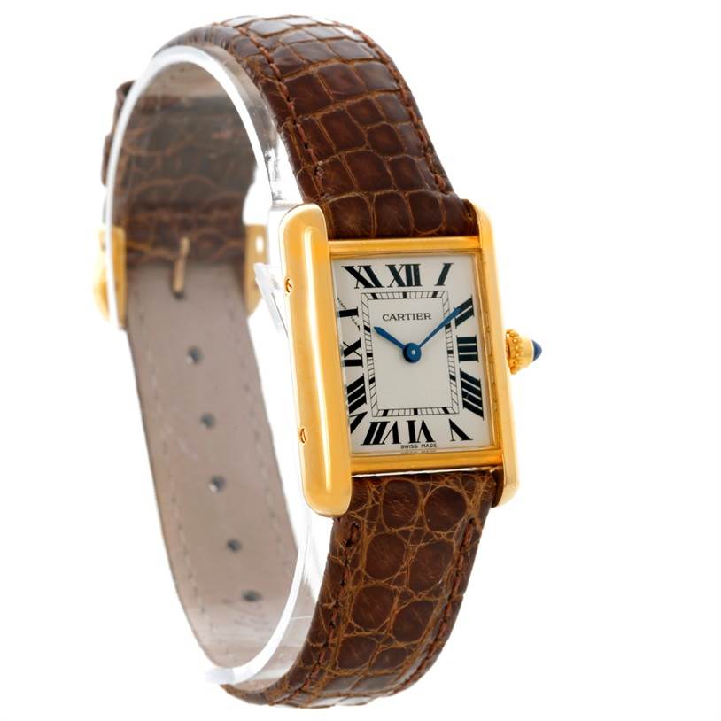 This image shows a Cartier Tank Louis W1529856 Women's Yellow Gold Silver Dial W1529856 Women's Yellow Gold Silver Dial watch angled to display its face, bezel, crown, and brown leather strap.