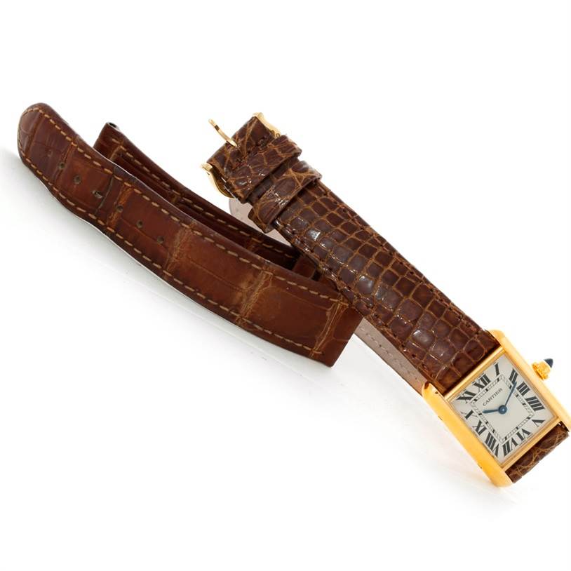 The image shows a Cartier Tank Louis W1529856 Women's Yellow Gold Silver Dial W1529856 Women's Yellow Gold Silver Dial watch, highlighting its front face and brown leather strap from an angled top-down perspective.