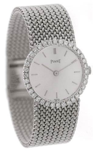 The image shows a front view of the Piaget 926/D/21 Women's White Gold Silver Dial 926/D/21 Women's White Gold Silver Dial Vintage Ladies 18k White Gold Diamond Watch, highlighting its face, bezel, and bracelet.