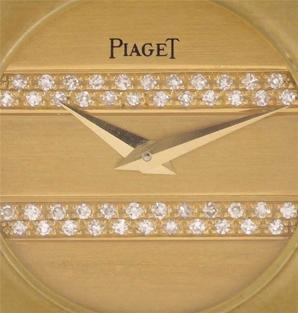 The image shows a close-up of the dial and hands of a Piaget 861C701 Women
s Yellow Gold Champagne Dial 861C701 Women
s Yellow Gold Champagne Dial Polo 861c701 Ladies 18k Gold Diamonds watch.