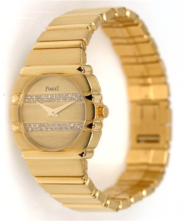 The image shows a Piaget 861C701 Women
s Yellow Gold Champagne Dial 861C701 Women
s Yellow Gold Champagne Dial Ladies 18k Gold Diamonds Polo 861c701 watch from an angled side view, highlighting its gold band and diamond dial.