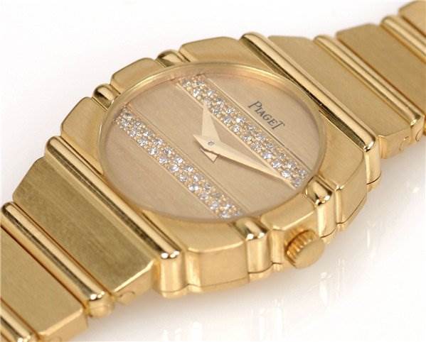 The image shows a close-up angle of the Piaget 861C701 Women
s Yellow Gold Champagne Dial 861C701 Women
s Yellow Gold Champagne Dial Ladies 18k Gold Diamonds Polo 861c701 watch, highlighting the face, crown, and part of the bracelet.