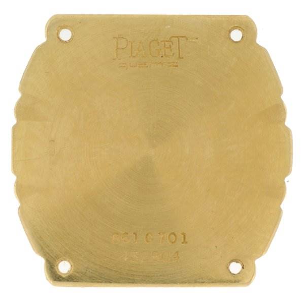 The image shows the back cover of a Ladies Polo 861c701 watch by Piaget 861C701 Women
s Yellow Gold Champagne Dial 861C701 Women
s Yellow Gold Champagne Dial, highlighting the engraving.