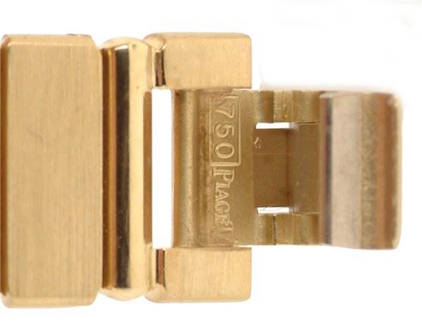 This close-up image shows the clasp mechanism of the Piaget 861C701 Women
s Yellow Gold Champagne Dial 861C701 Women
s Yellow Gold Champagne Dial Ladies 18k Gold Diamonds Polo 861c701 model watch.