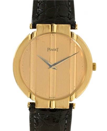 The image shows a front view of the Piaget 8673 Men's Yellow Gold Champagne Dial 8673 Men's Yellow Gold Champagne Dial Mens 18k Yellow Gold Polo 8673 Unworn Watch, highlighting its gold case and black leather strap.