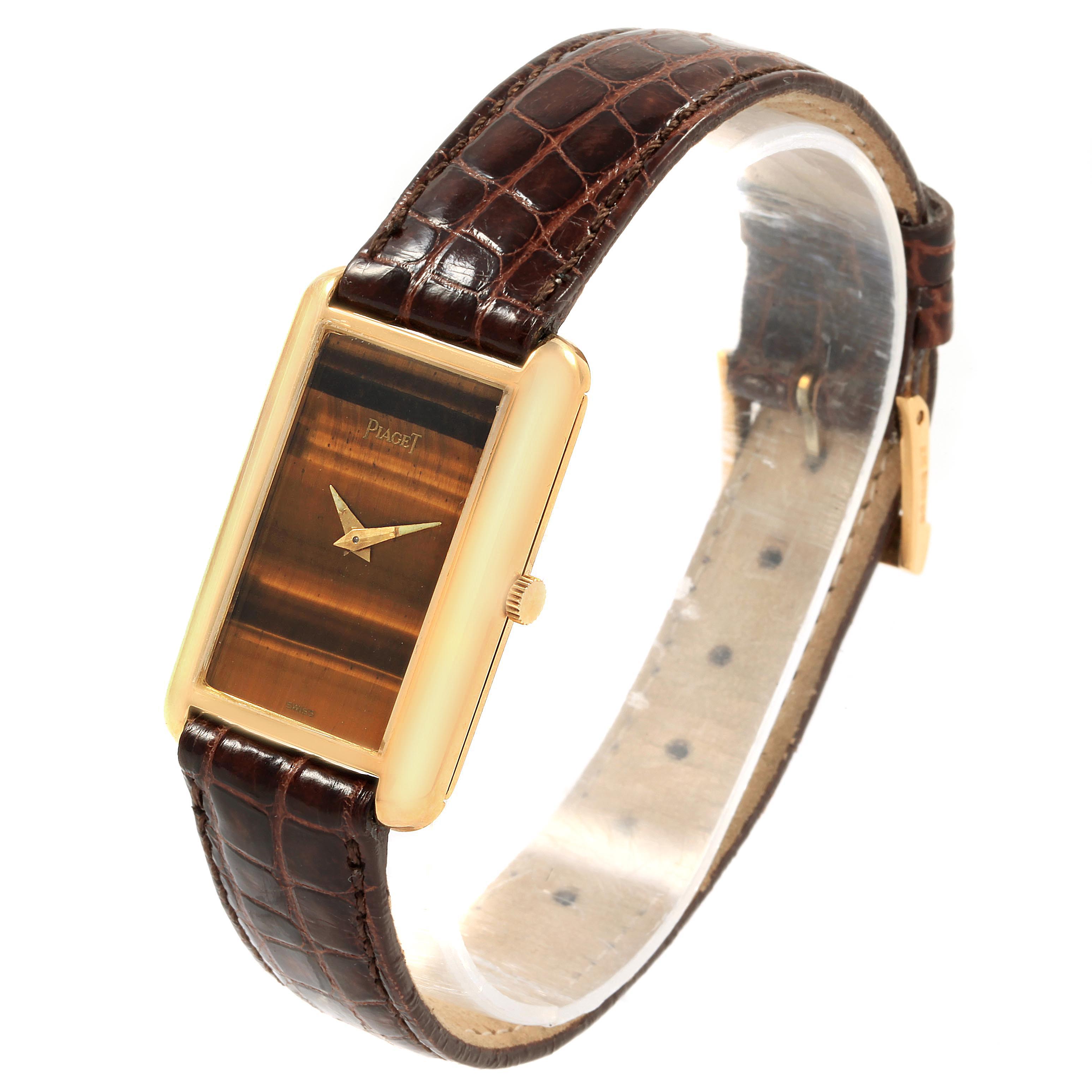 The Piaget 9228 Women's Yellow Gold Brown Dial 9228 Women's Yellow Gold Brown Dial 9228 18K Yellow Gold Tiger Eye Stone Dial Ladies Watch is shown at a slight angle, highlighting the dial, case, and strap.