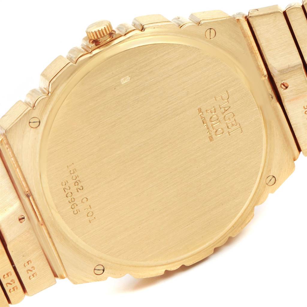 The image shows the back case and part of the bracelet of the Piaget Men's Yellow Gold Champagne Dial Men's Yellow Gold Champagne Dial Polo 18K Yellow Gold Day Date Men's Watch 15562c701 model.