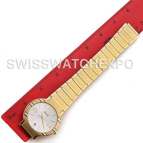 The image shows a top-down angle of the Piaget GOA26021 Men's Yellow Gold Silver Dial GOA26021 Men's Yellow Gold Silver Dial Polo New Style Mens 18K Yellow Gold GOA26021 Watch, laid next to a red ruler for scale.