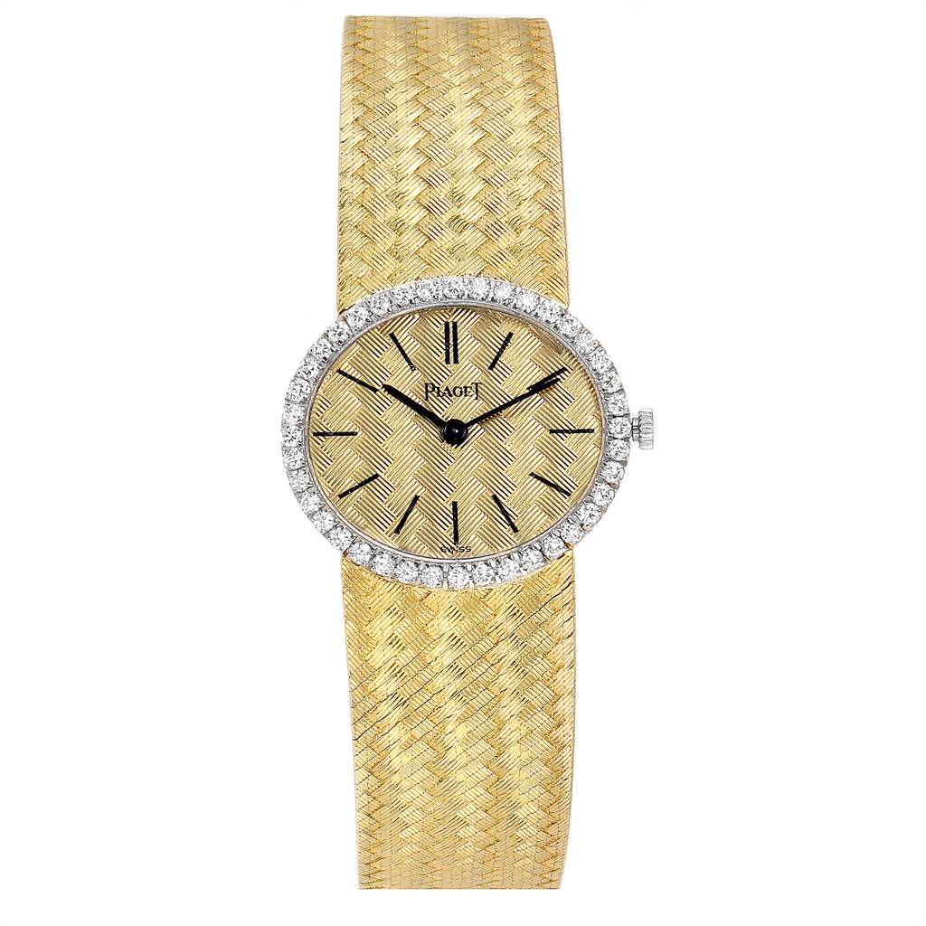 The image shows a front view of the Piaget 9806 Women
s Yellow Gold Champagne Dial 9806 Women
s Yellow Gold Champagne Dial 9806 18k Yellow Gold Diamond Ladies Watch, highlighting its intricate band and diamond-encrusted bezel.
