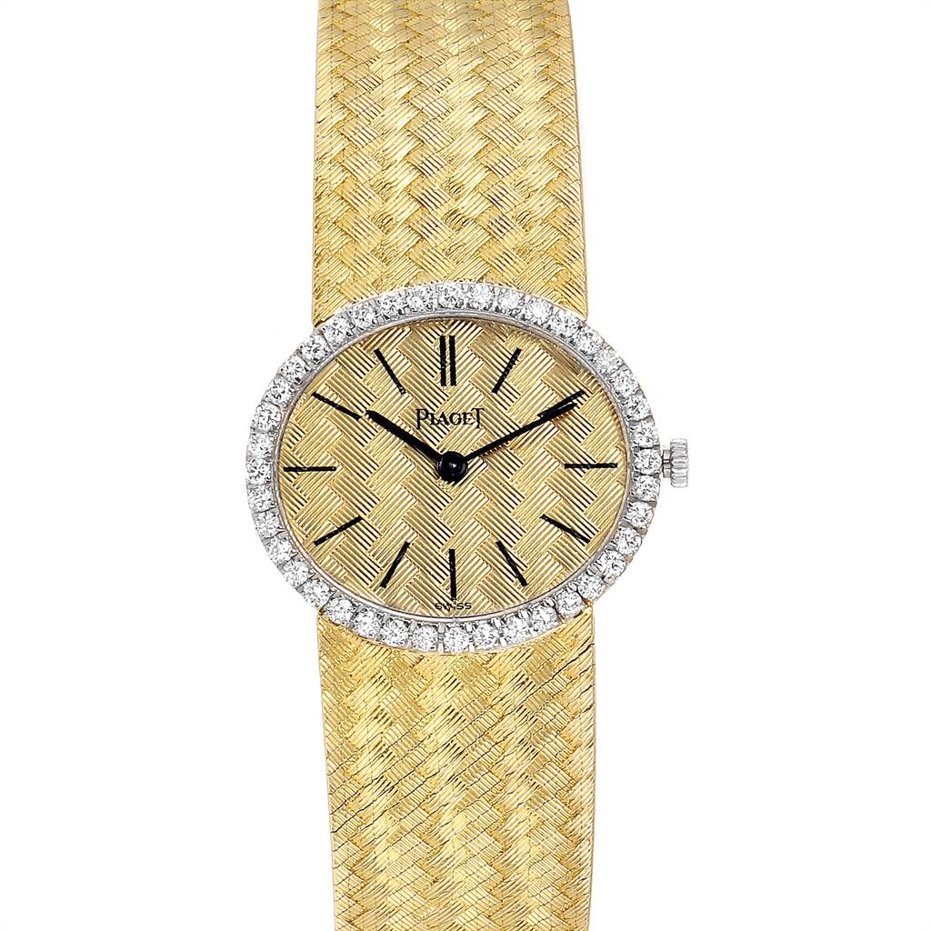 The image shows a full view of the Piaget 9806 Women
s Yellow Gold Champagne Dial 9806 Women
s Yellow Gold Champagne Dial 9806 18k Yellow Gold Diamond Ladies Watch, featuring its textured bracelet and diamond-studded bezel.