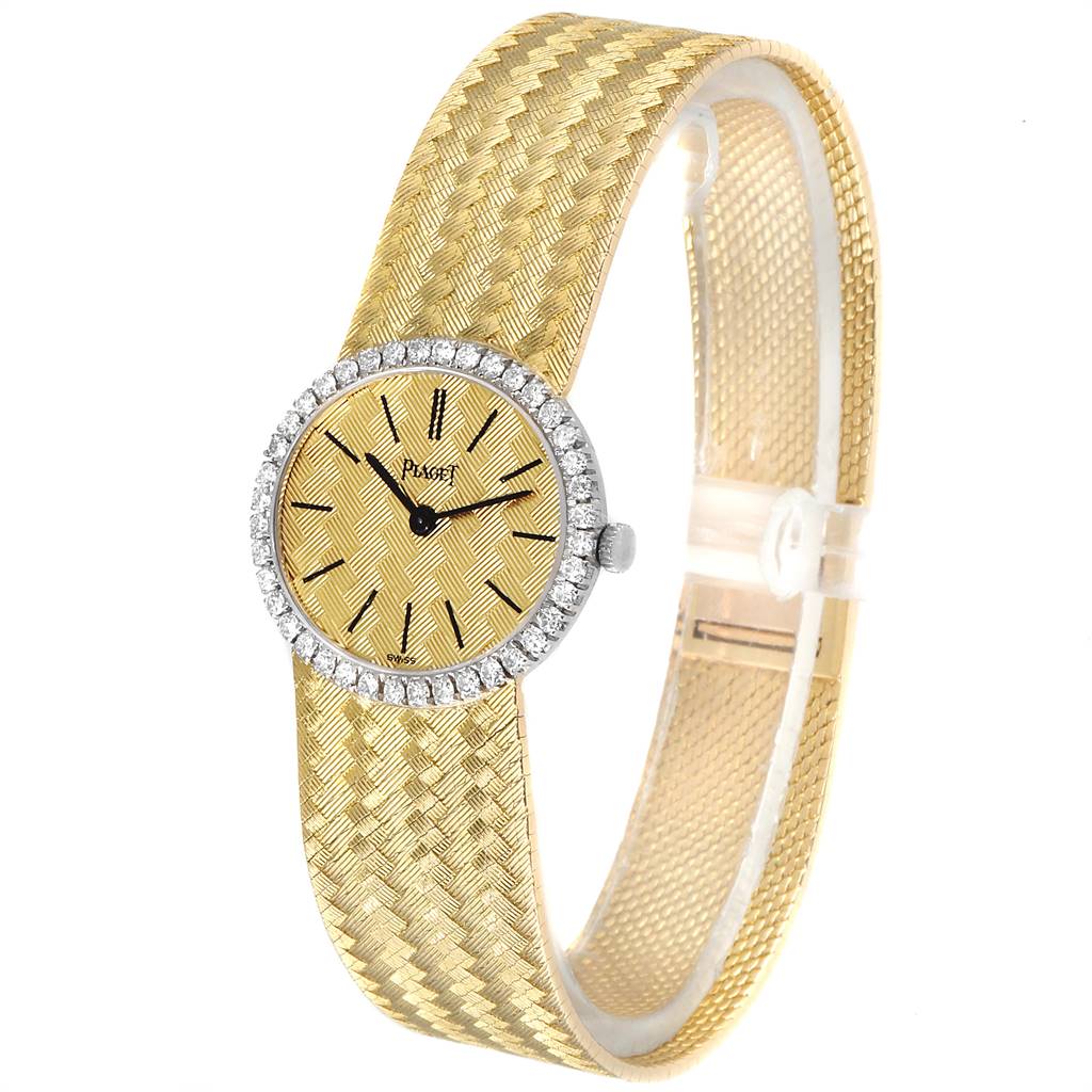 The Piaget 9806 Women
s Yellow Gold Champagne Dial 9806 Women
s Yellow Gold Champagne Dial 9806 18k Yellow Gold Diamond Ladies Watch is shown at a slight angle, displaying its face, bezel, and band.