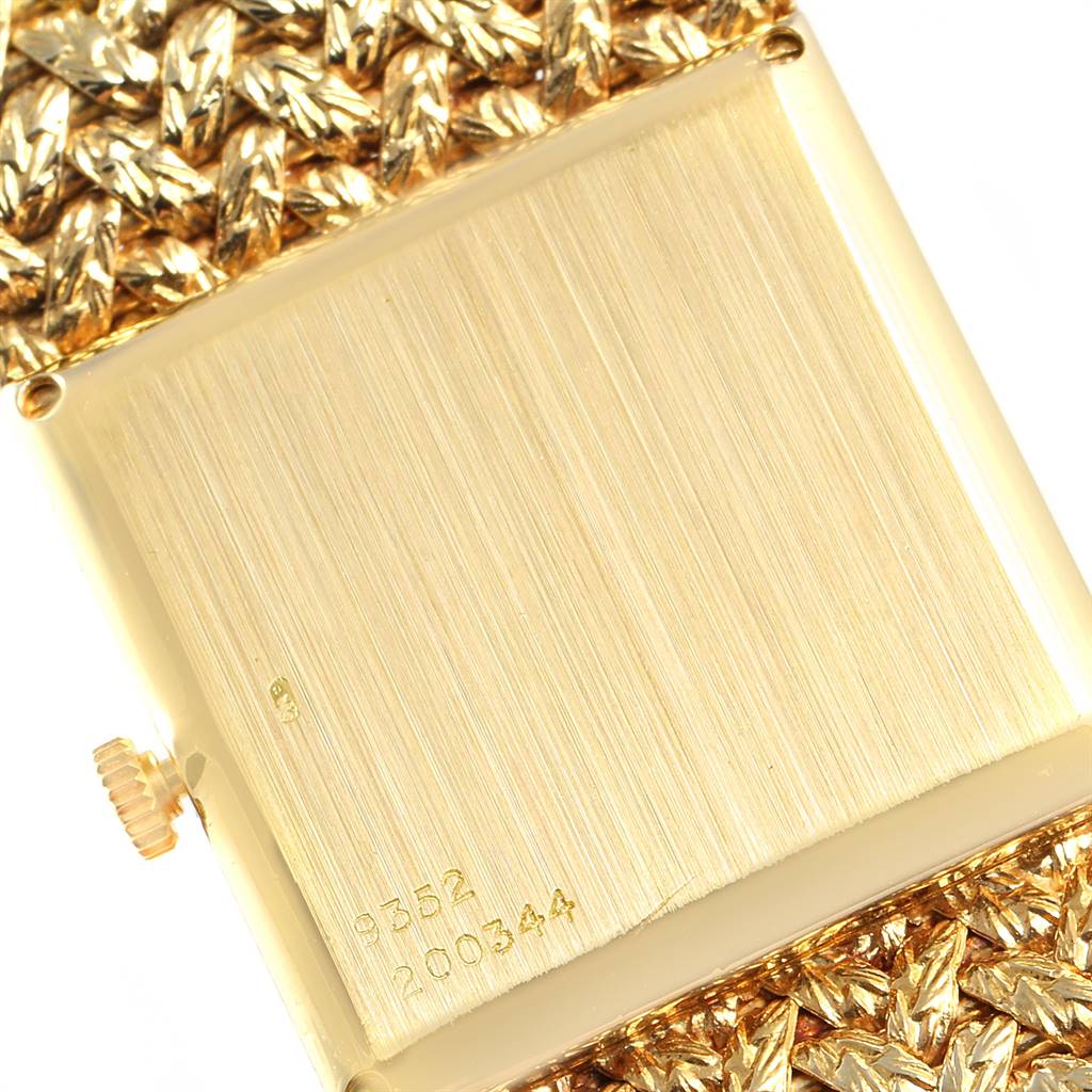 The image shows the rear of the Piaget 9352 Men's Yellow Gold Blue Dial 9352 Men's Yellow Gold Blue Dial 9352 model watch, focusing on the back case and part of the gold bracelet.