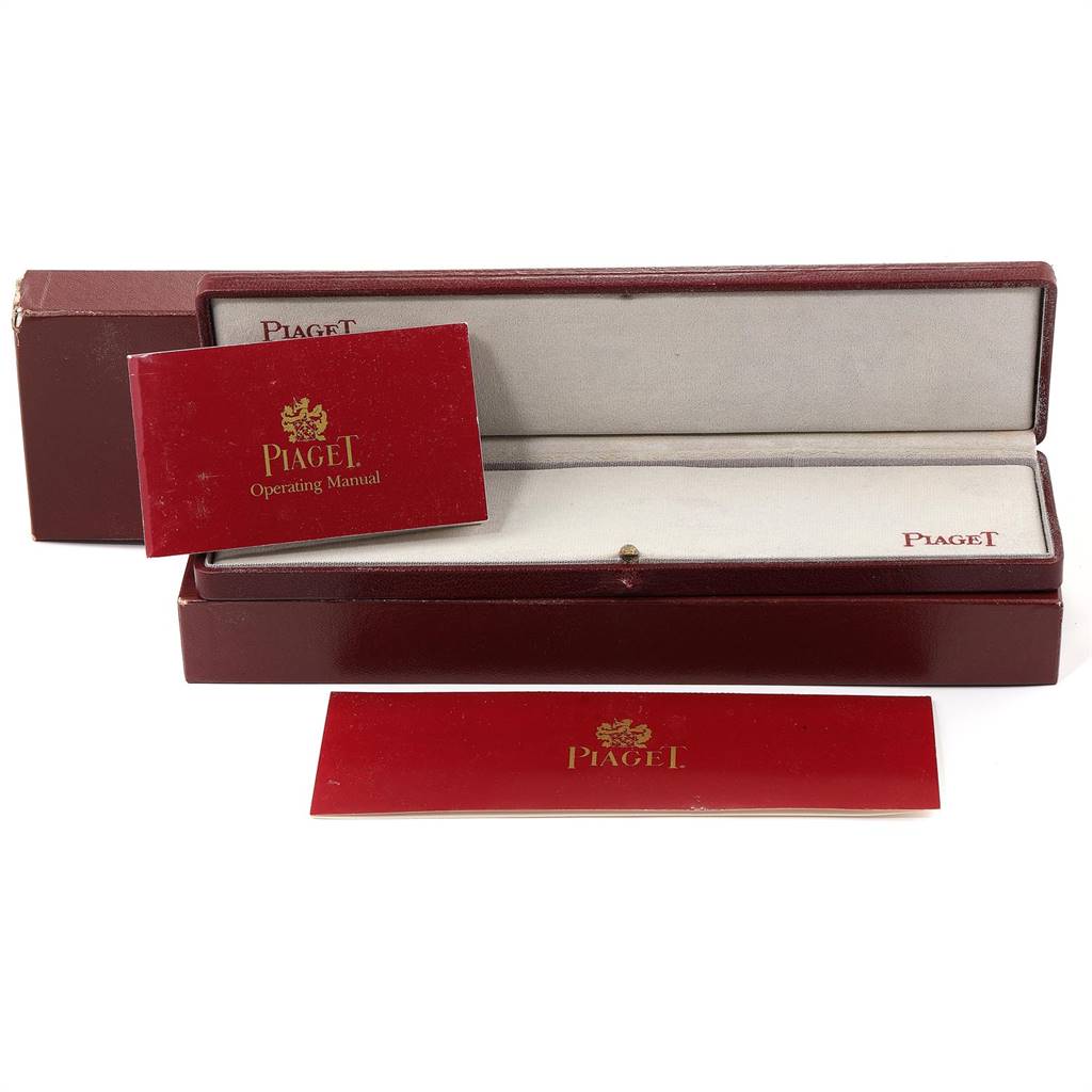 This image shows the box and operating manual of the Piaget 9352 Men's Yellow Gold Blue Dial 9352 Men's Yellow Gold Blue Dial 9352 model watch, without the actual watch.