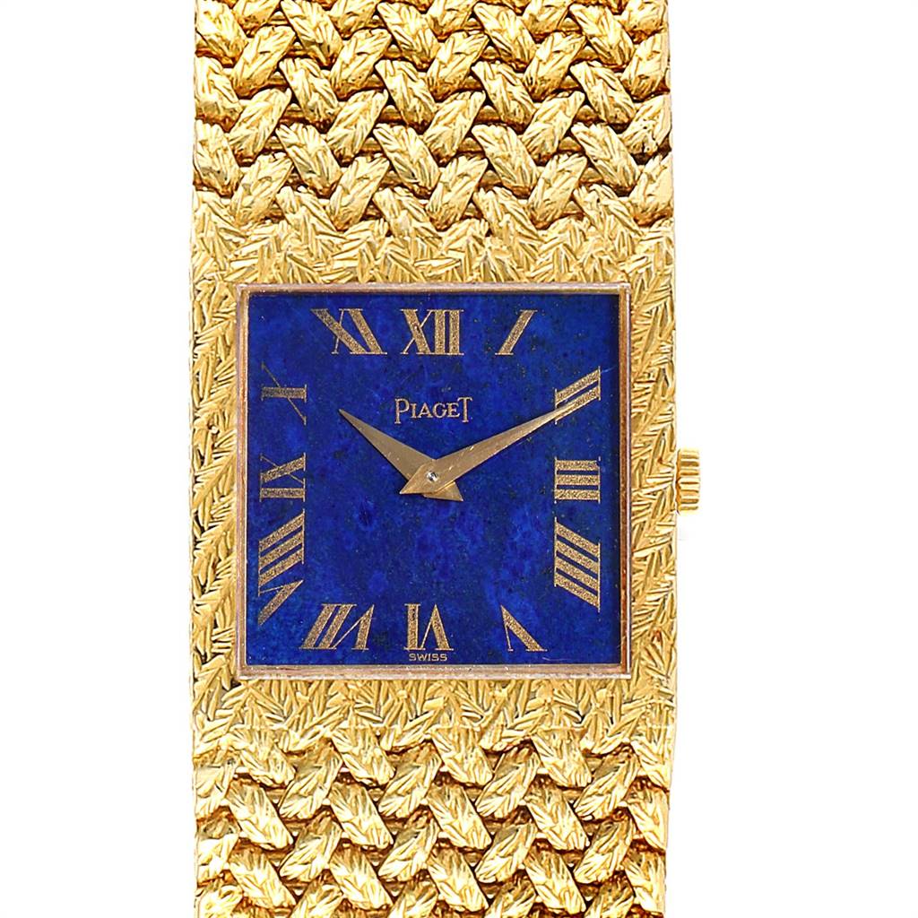 This image shows a close-up of the Piaget 9352 Men's Yellow Gold Blue Dial 9352 Men's Yellow Gold Blue Dial 9352 vintage men's watch, highlighting the 18k yellow gold case and blue lapis lazuli dial.
