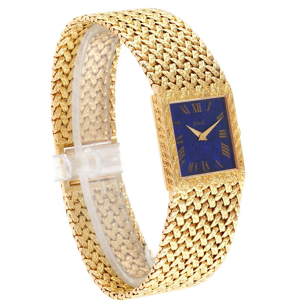 The image shows a Piaget 9352 Men's Yellow Gold Blue Dial 9352 Men's Yellow Gold Blue Dial 9352 model watch at a three-quarter angle, highlighting its 18k yellow gold bracelet and blue Lapis Lazuli dial.