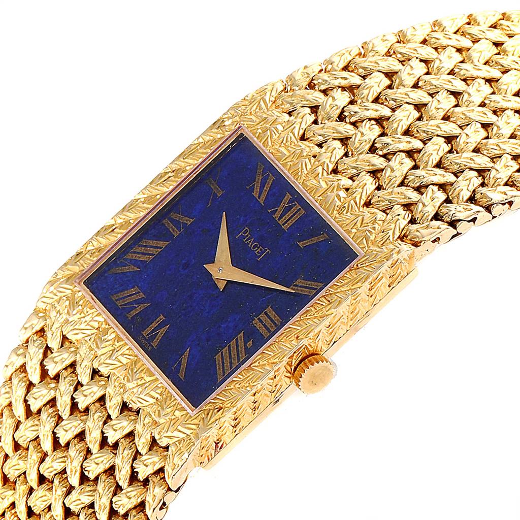 The Piaget 9352 Men's Yellow Gold Blue Dial 9352 Men's Yellow Gold Blue Dial 9352 vintage men's watch is shown at an angle displaying its 18k yellow gold case, blue lapis lazuli dial, and textured bracelet.