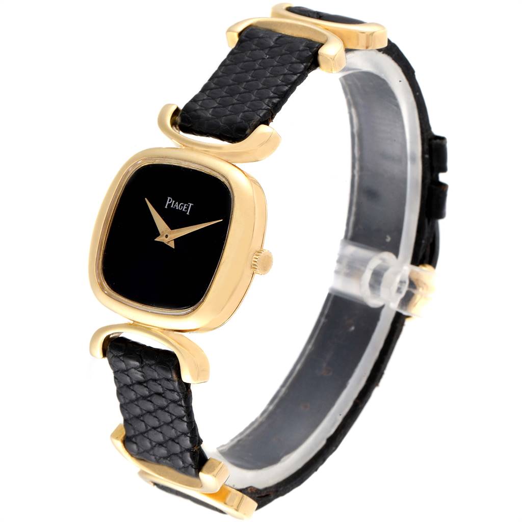 The Piaget 9451 Women's Yellow Gold Black Dial 9451 Women's Yellow Gold Black Dial Solo Tempo Yellow Gold Black Onyx Dial Vintage Ladies Watch 9451 is shown at a side angle, displaying the strap, dial, and case.