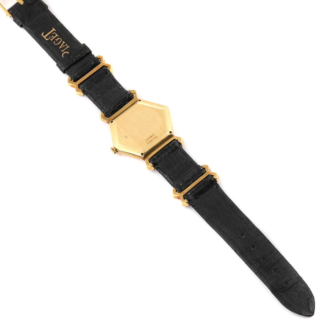 This image shows the back view of the Piaget 9559 Women's Yellow Gold Pink Dial 9559 Women's Yellow Gold Pink Dial model 9559 hexagonal vintage ladies watch with an 18K yellow gold case and black leather strap.