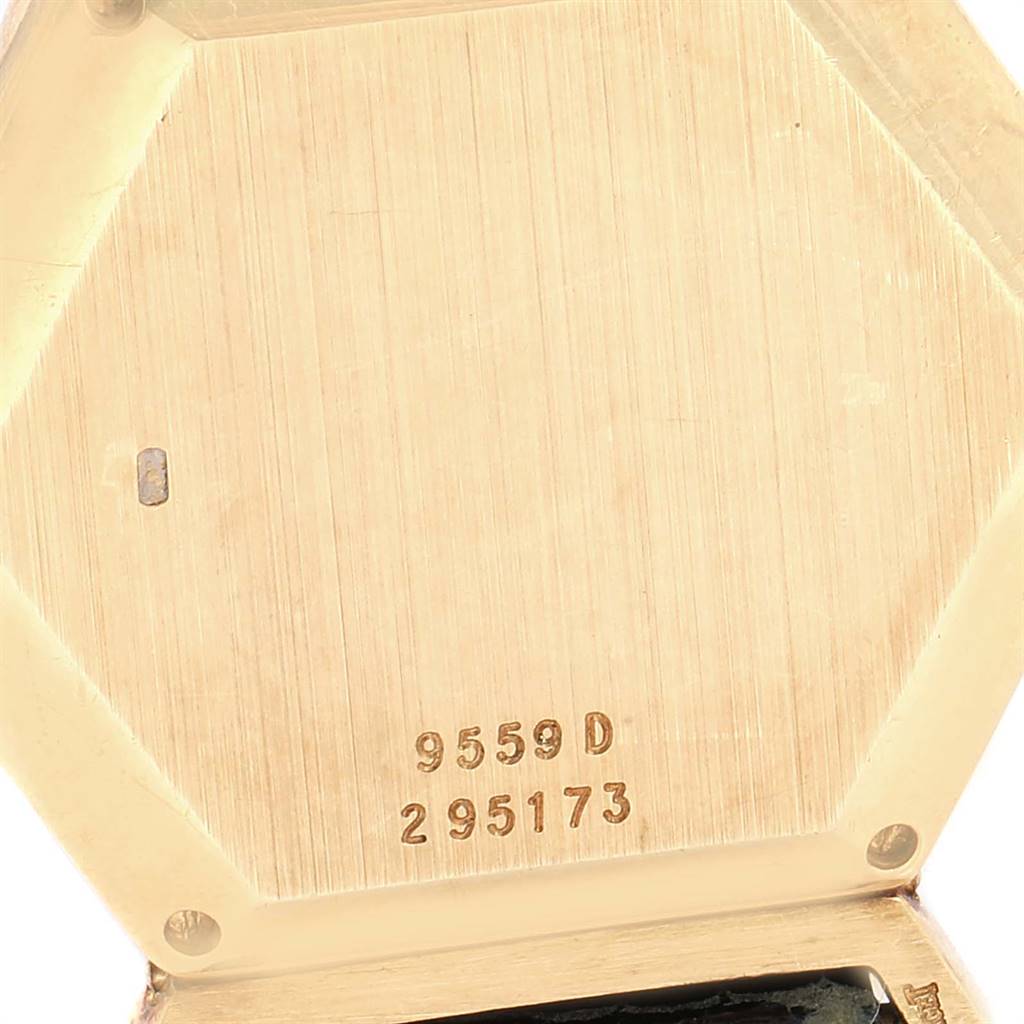 This image shows the back case of the Piaget 9559 Women's Yellow Gold Pink Dial 9559 Women's Yellow Gold Pink Dial 9559 D model, highlighting the hexagonal shape and serial number.