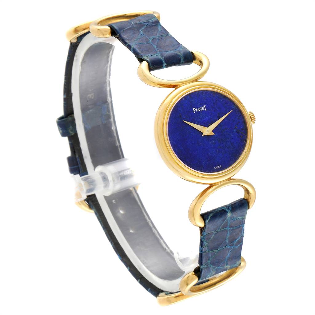 The image shows a side angle of the Piaget 9451 Women's Yellow Gold Blue Dial 9451 Women's Yellow Gold Blue Dial Classique Yellow Gold Lapis Dial Vintage Ladies Watch 9451 model, highlighting the dial and band.