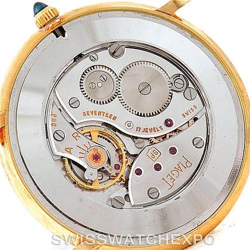 The image shows the open case back of a Piaget 9035 Men
s Yellow Gold White Dial 9035 Men
s Yellow Gold White Dial 18K Yellow Gold Mechanical Men
s Watch 9035 model, revealing its intricate movement.