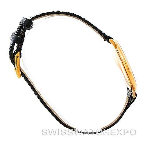 The image shows a side profile of the Piaget 9035 Men
s Yellow Gold White Dial 9035 Men
s Yellow Gold White Dial 18K Yellow Gold Mechanical Men
s Watch 9035, highlighting its gold case and black strap.