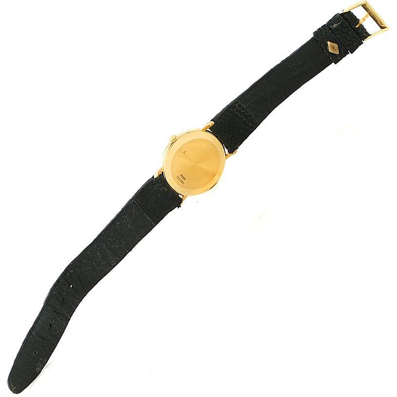 The image shows the back view of the Piaget 9025 Men's Yellow Gold White Dial 9025 Men's Yellow Gold White Dial 9025 model 18K Yellow Gold Mechanical Men's Watch with a black leather strap.