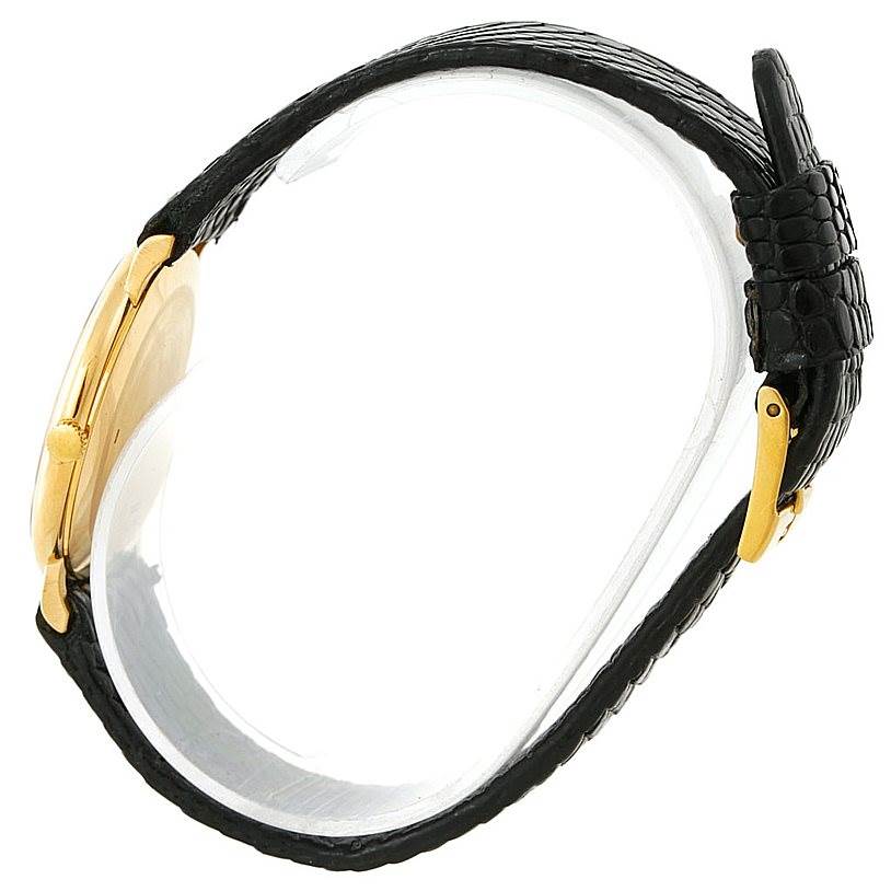 The image shows a side view of the Piaget 9025 Men's Yellow Gold White Dial 9025 Men's Yellow Gold White Dial 9025 model 18K Yellow Gold Mechanical Men's Watch, highlighting its case, buckle, and strap.