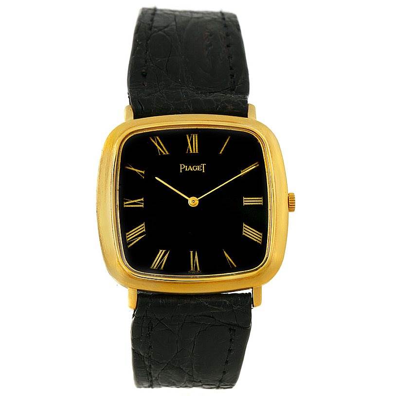 The image shows a front view of the Piaget Men's Yellow Gold Black Dial Men's Yellow Gold Black Dial 18K Yellow Gold Cushion Shape Mechanical Men's Watch, including its black leather strap.