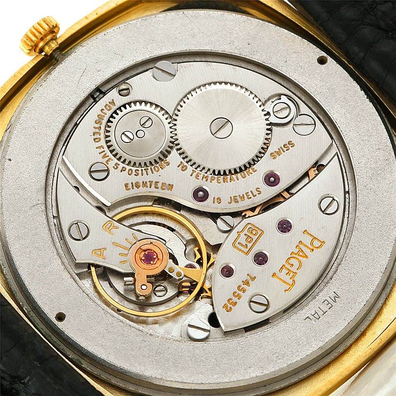 This image shows the mechanical movement of the Piaget Men's Yellow Gold Black Dial Men's Yellow Gold Black Dial 18K Yellow Gold Cushion Shape Mens Watch viewed from the back.