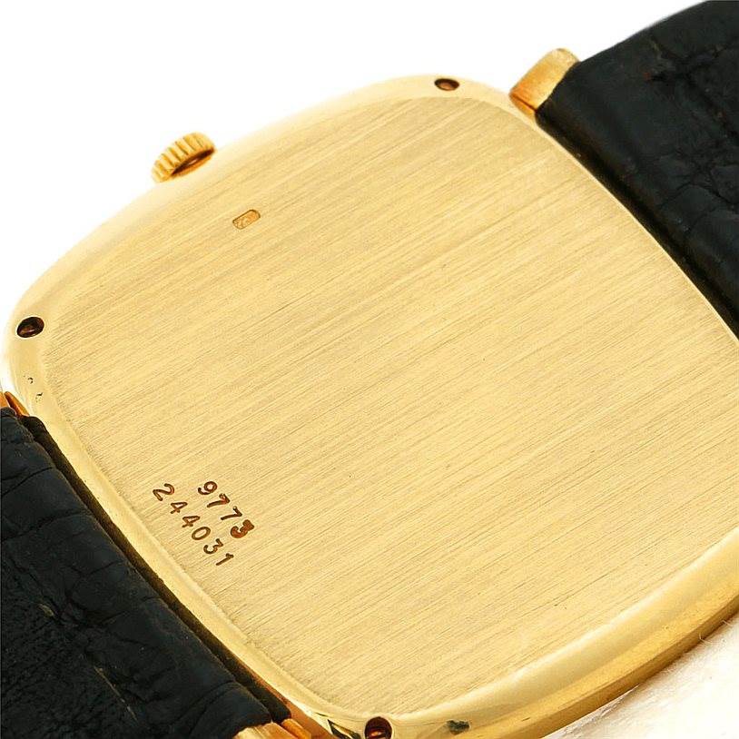 The image shows the back case and strap connections of a Piaget Men's Yellow Gold Black Dial Men's Yellow Gold Black Dial 18K Yellow Gold Cushion Shape Mechanical Men's Watch.