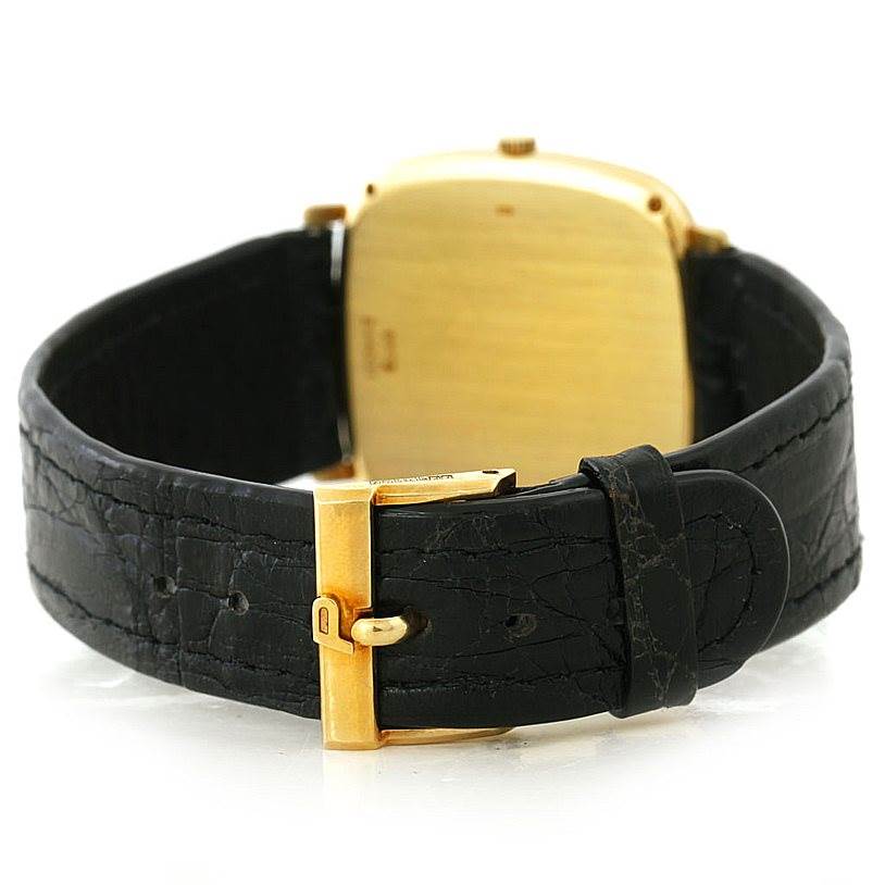 This is the rear view of the Piaget Men's Yellow Gold Black Dial Men's Yellow Gold Black Dial 18K Yellow Gold Cushion Shape Mechanical Men's Watch, showcasing the clasp and case back.