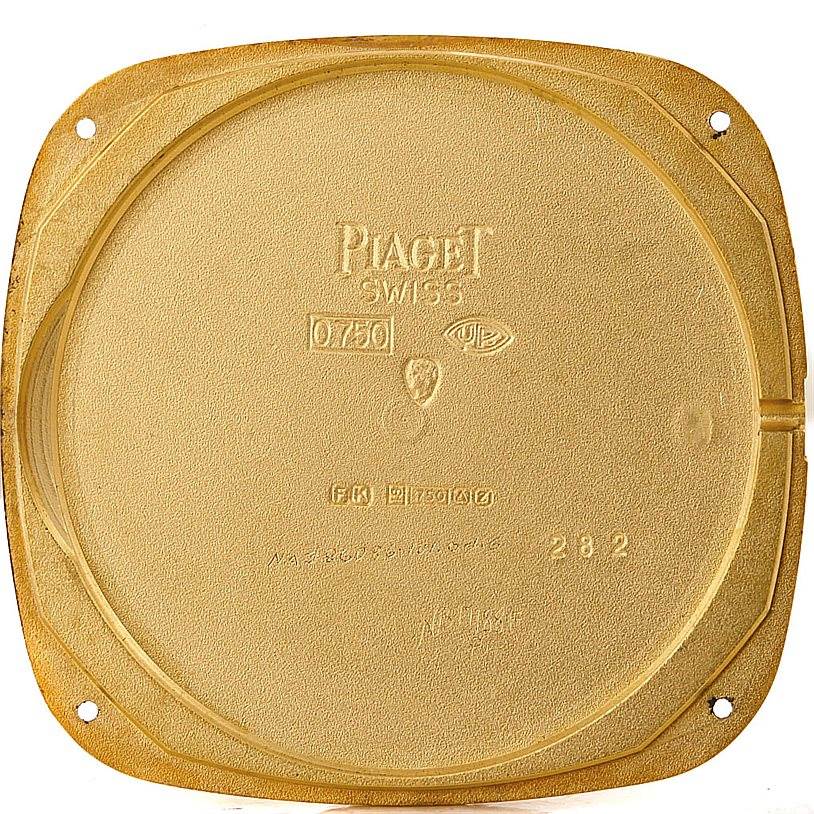 This is the back cover of a Piaget Men's Yellow Gold Black Dial Men's Yellow Gold Black Dial 18K Yellow Gold Cushion Shape Mechanical Men's Watch.