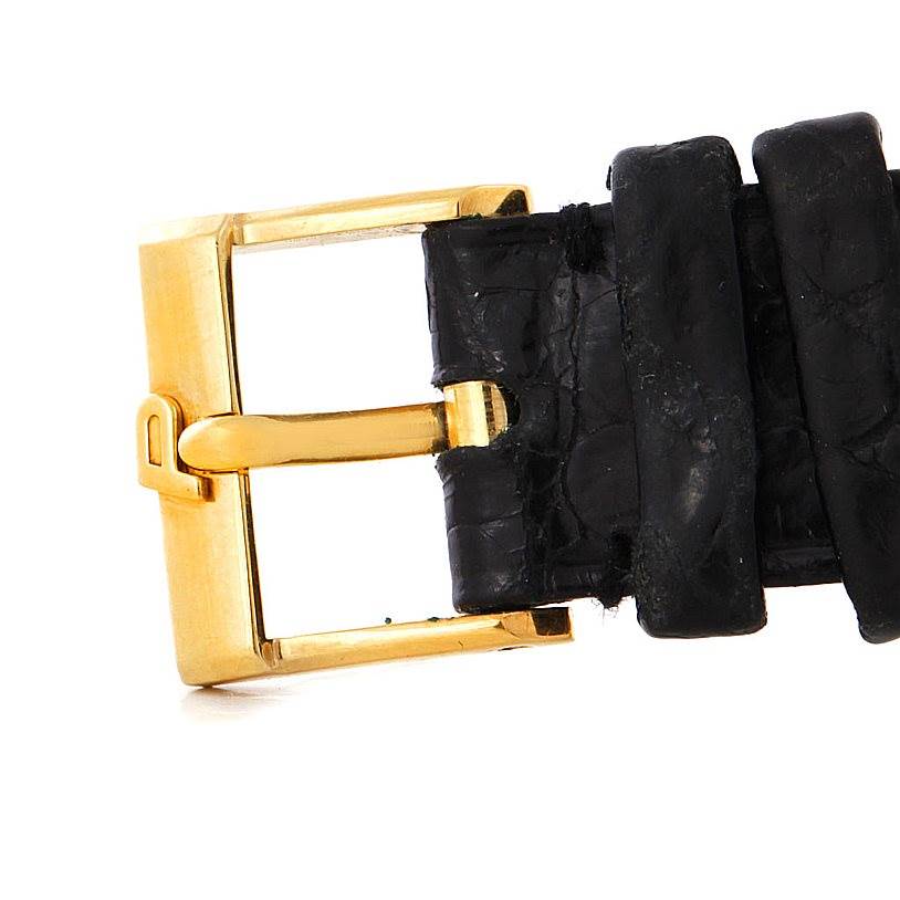 This image shows the buckle and part of the black leather strap of the Piaget 9154 Men's Yellow Gold Black Dial 9154 Men's Yellow Gold Black Dial 18K Yellow Gold Cushion Shape Mens Watch 9154 model.