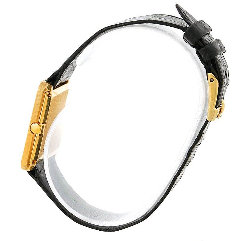 The image shows a side profile of the Piaget 9154 Men's Yellow Gold Black Dial 9154 Men's Yellow Gold Black Dial 9154 model 18K Yellow Gold Cushion Shape Men's Watch, highlighting the case and strap.