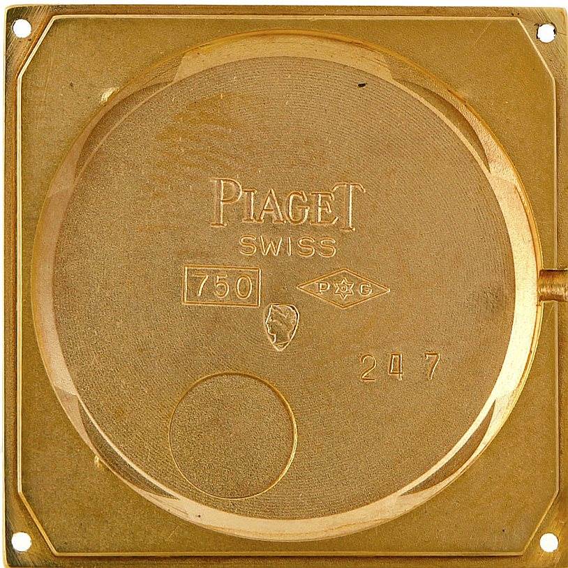 This image shows the case back of the Piaget 9154 Men's Yellow Gold Black Dial 9154 Men's Yellow Gold Black Dial model 9154, revealing its engravings and 18K yellow gold material.