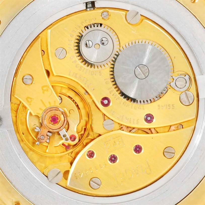 This close-up image shows the intricate mechanical movement of a Piaget 91000 Men's Yellow Gold Silver Dial 91000 Men's Yellow Gold Silver Dial 91000 18K Yellow Gold Limited Edition Men's Watch.