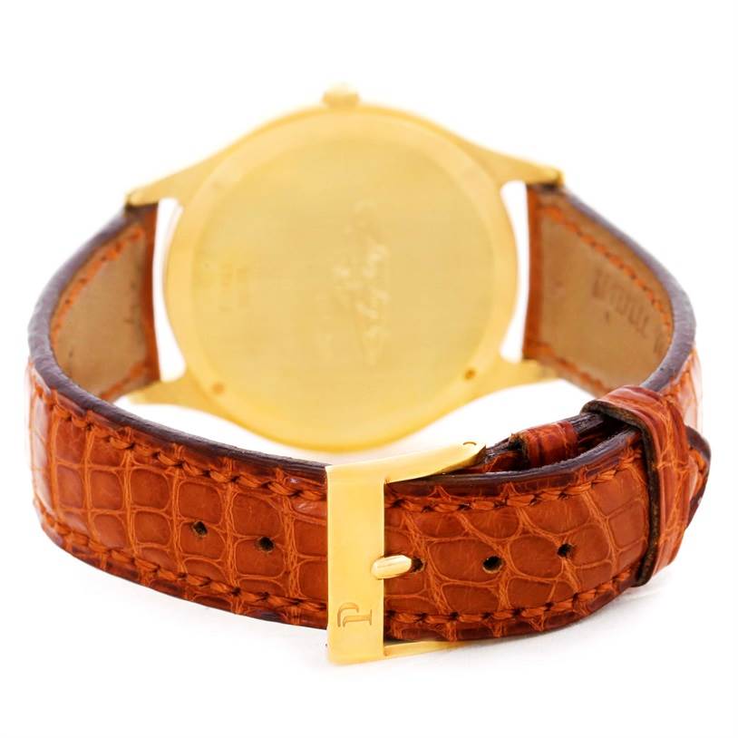 The image shows the back and strap of a Piaget 91000 Men's Yellow Gold Silver Dial 91000 Men's Yellow Gold Silver Dial 91000 Limited Edition 18K Yellow Gold Mechanical Men's Watch.