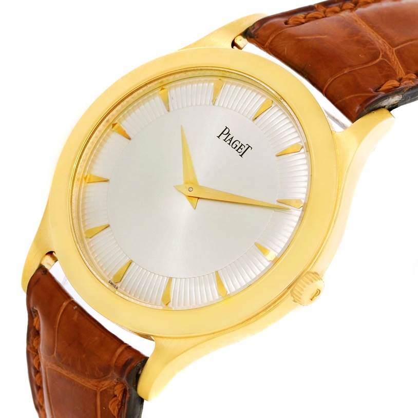 The Piaget 91000 Men's Yellow Gold Silver Dial 91000 Men's Yellow Gold Silver Dial 91000 18K Yellow Gold Mechanical Limited Edition Men's Watch is shown at an oblique angle, highlighting the dial, crown, and leather strap.