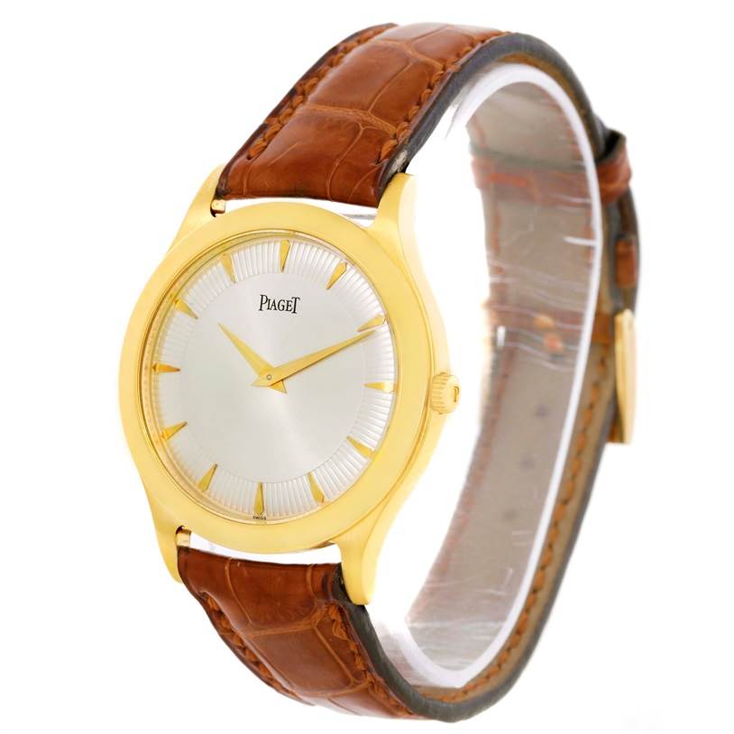 The image shows a Piaget 91000 Men's Yellow Gold Silver Dial 91000 Men's Yellow Gold Silver Dial model 91000 18K Yellow Gold Men's Mechanical Limited Edition Watch at an angled side view highlighting the dial and leather strap.