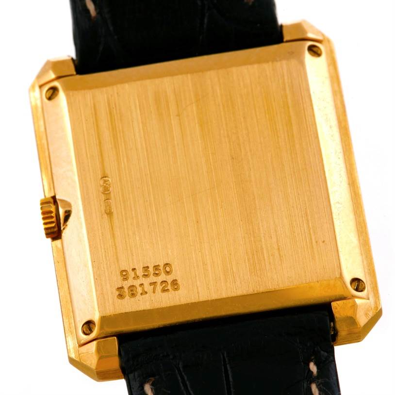 This image shows the back of the Piaget Men's Yellow Gold Champagne Dial Men's Yellow Gold Champagne Dial 18K Yellow Gold Cushion Shape Diamond Mechanical Men's Watch model.