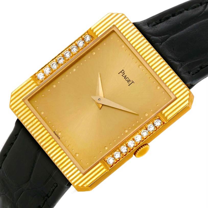 The Piaget Men's Yellow Gold Champagne Dial Men's Yellow Gold Champagne Dial 18K Yellow Gold Cushion Shape Diamond Mechanical Mens Watch is shown at a slight angle displaying the face, bezel, diamonds, and crown.