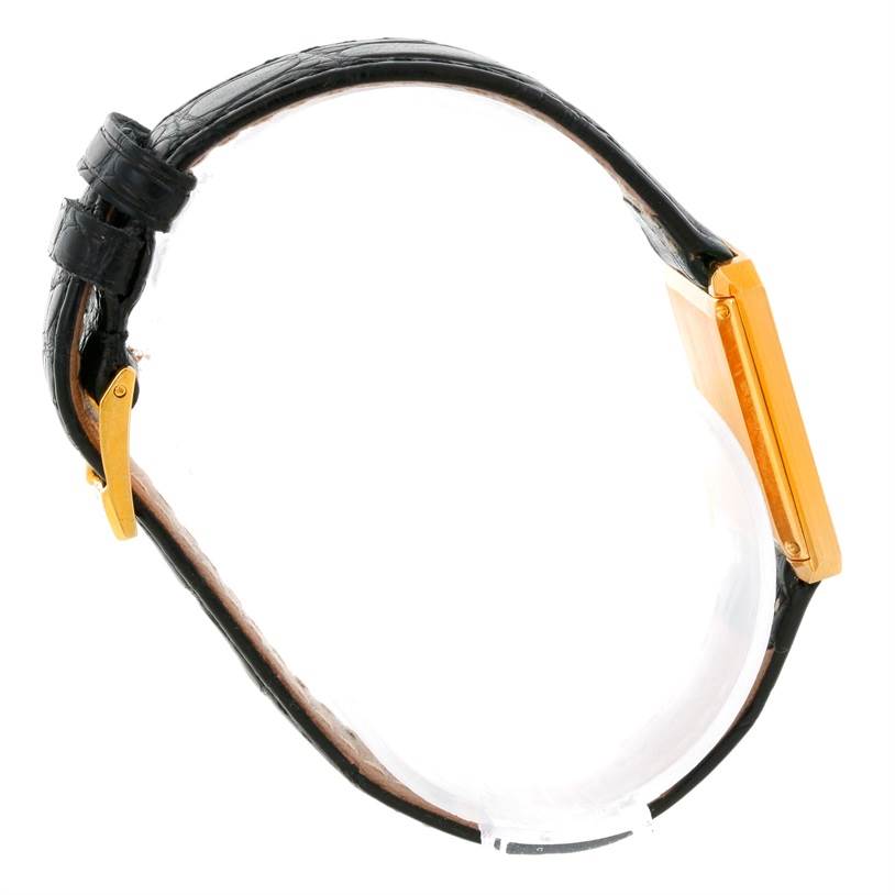 Side view of the Piaget Men's Yellow Gold Champagne Dial Men's Yellow Gold Champagne Dial 18K Yellow Gold Cushion Shape Diamond Mechanical Mens Watch showing the strap and case.