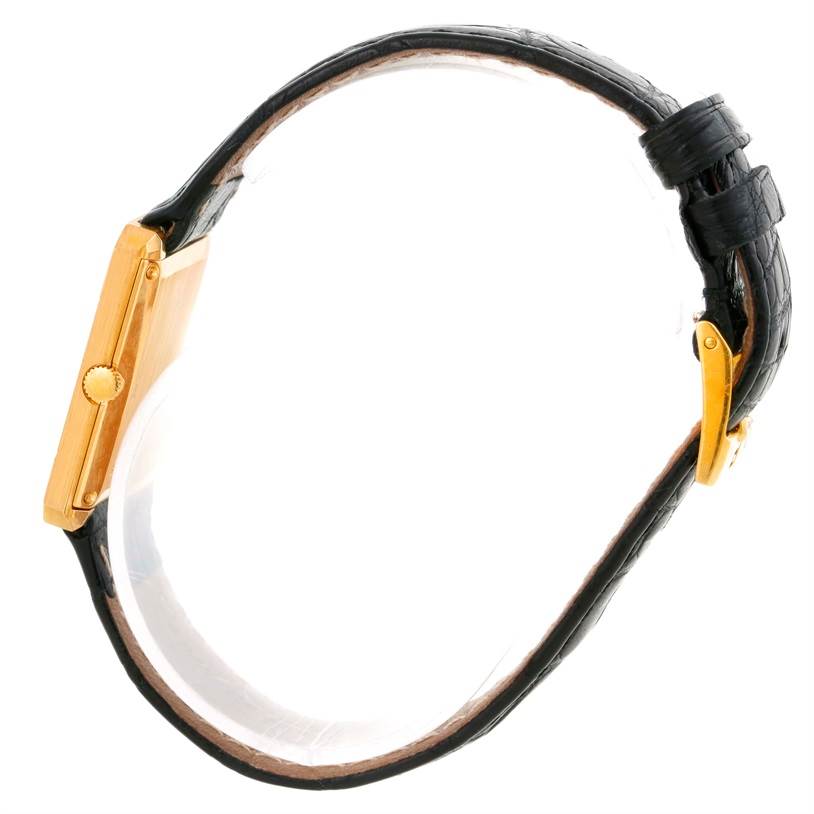 The image shows a side view of the Piaget Men's Yellow Gold Champagne Dial Men's Yellow Gold Champagne Dial 18K Yellow Gold Cushion Shape Diamond Mechanical Men's Watch, highlighting the crown, case, and leather strap.