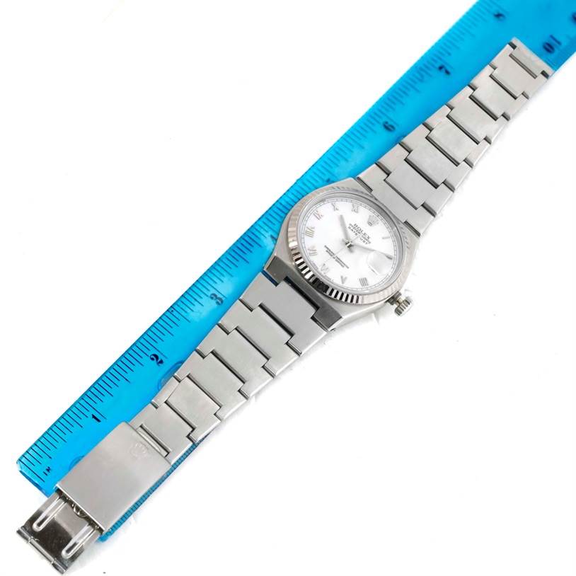 The image shows a top-down view of a Rolex Oysterquartz 17000 Men
s Stainless Steel White Dial 17000 Men
s Stainless Steel White Dial watch, featuring the face, case, and bracelet with a ruler for scale.